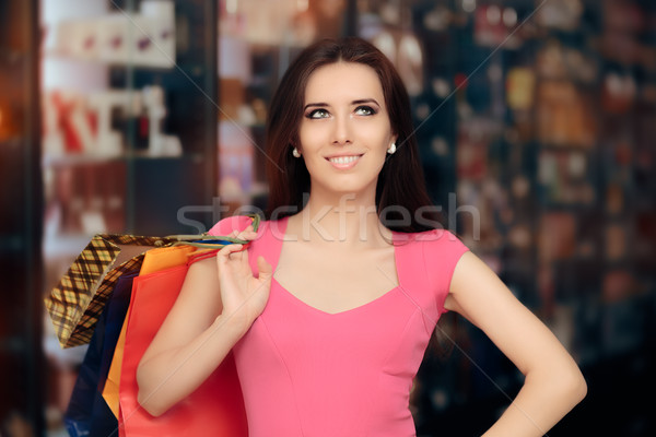 Feliz mujer compras tienda sonriendo nina Foto stock © NicoletaIonescu