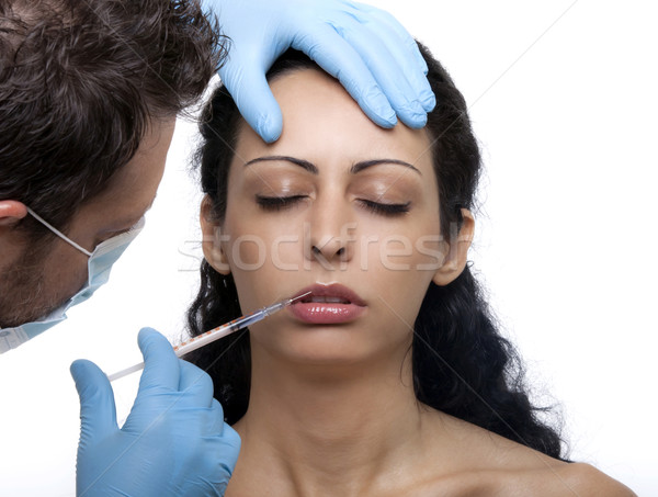 Femeie seringă tratament botox mâini Imagine de stoc © NikiLitov