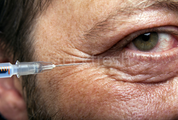 Férfi injekciós tű kezelés botox kollagén szépség Stock fotó © NikiLitov