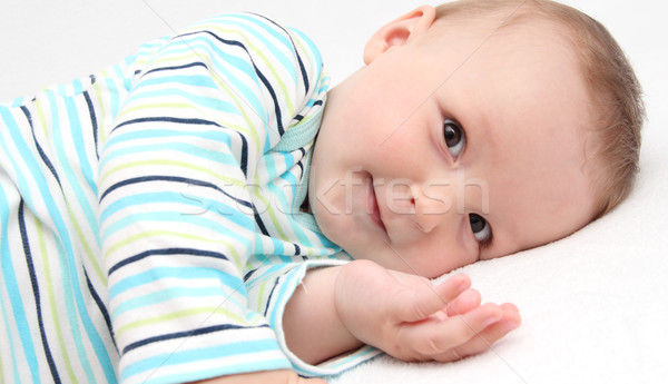 little baby lying in bed and look at the camera Stock photo © nikkos