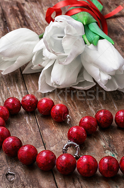 tulips and womens coral beads Stock photo © nikolaydonetsk