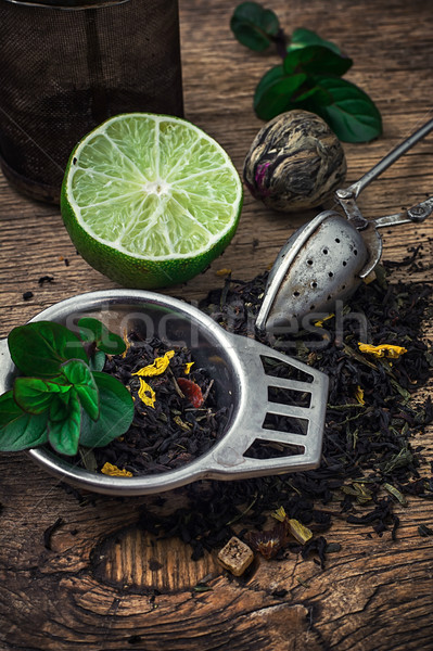 tea brew with lime and mint on wooden background  Stock photo © nikolaydonetsk