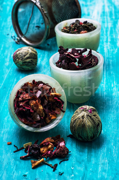 variety of dry tea leaves in jade stacks on wooden background Stock photo © nikolaydonetsk