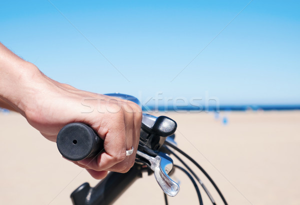 young man riding a bicycle by the ocean Stock photo © nito
