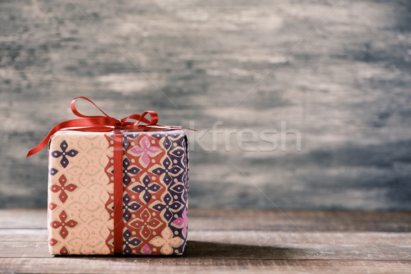 cozy gift on a wooden surface Stock photo © nito