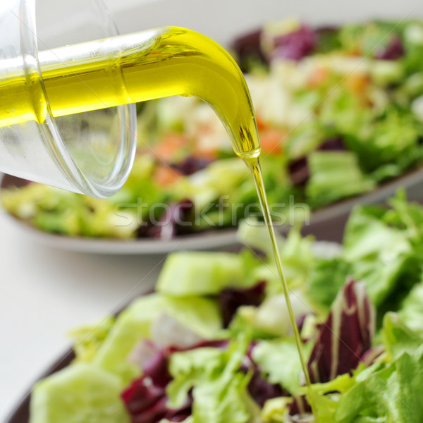 Zöld saláta tányérok keverék levelek olívaolaj Stock fotó © nito