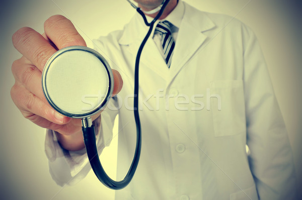 Stock photo: doctor using a stethoscope, with a retro effect