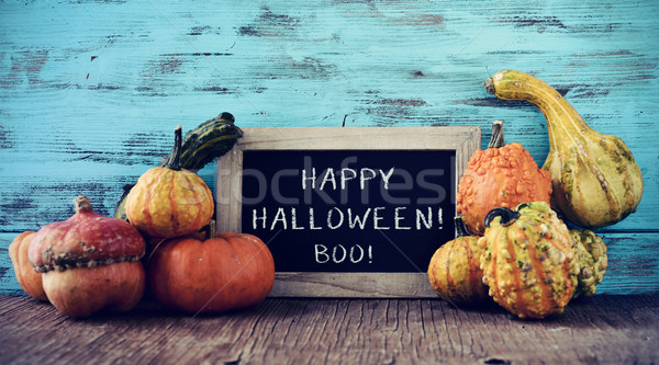 pumpkins and chalkboard with text happy halloween Stock photo © nito