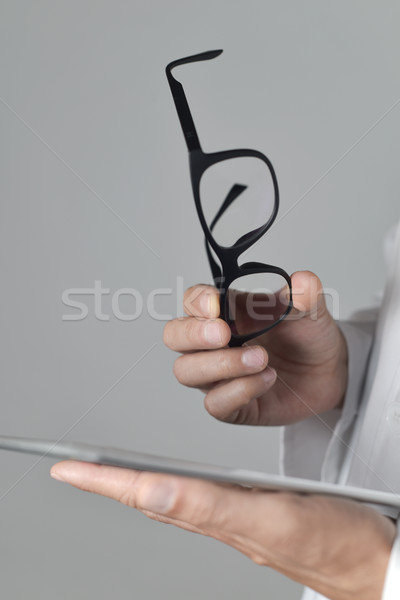 optician man checking a tablet Stock photo © nito