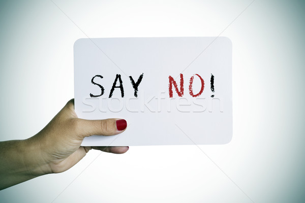 woman holding a signboard with the text say no Stock photo © nito