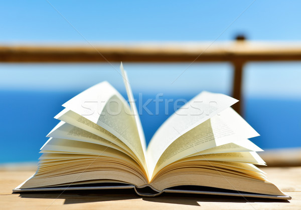 Stock photo: open book in front of the ocean