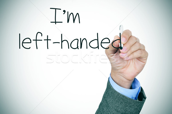 Stock photo: left-handed writting the text I am left-handed
