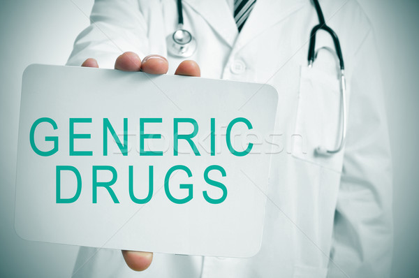 doctor with a signboard with the text generic drugs Stock photo © nito
