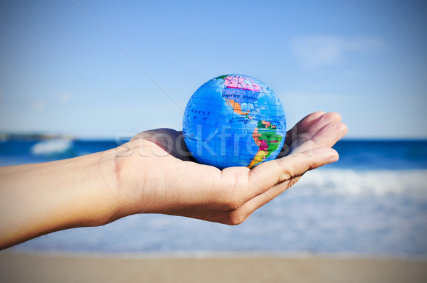 young man with a world globe in his hand, vignetted Stock photo © nito