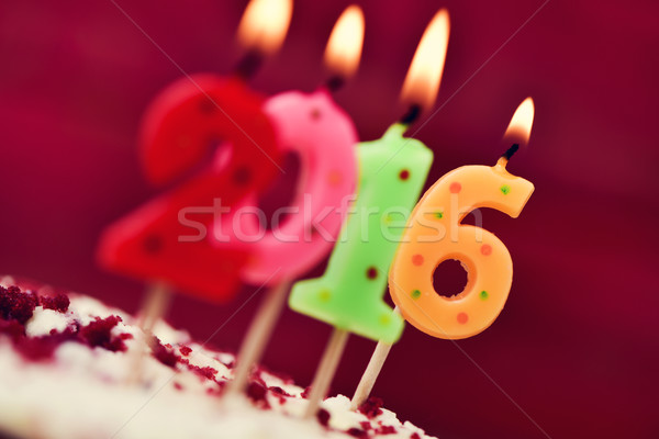 lit number-shaped candles forming number 2016 on a cake Stock photo © nito