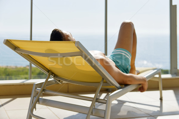 young man sun tanning in a sunlounger Stock photo © nito