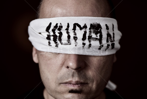 Stock photo: young man with a blindfold in his eyes