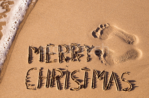 text merry christmas in the sand of a beach Stock photo © nito