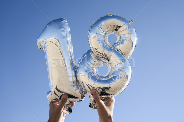 Balony numer 18 ręce młody człowiek Zdjęcia stock © nito