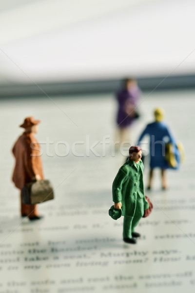 miniature traveler people on an e-book reader Stock photo © nito