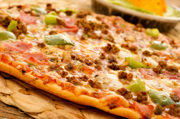 Stock photo: pizza with ground beef, ham, onion and green pepper