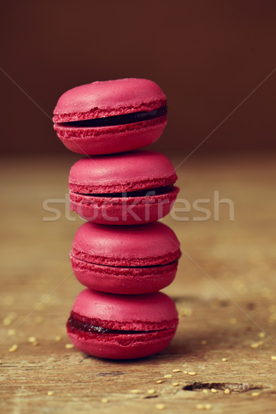 red macarons on a rustic wooden surface Stock photo © nito