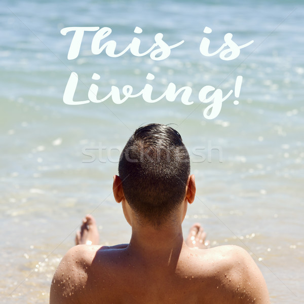 man on the beach and text this is living Stock photo © nito