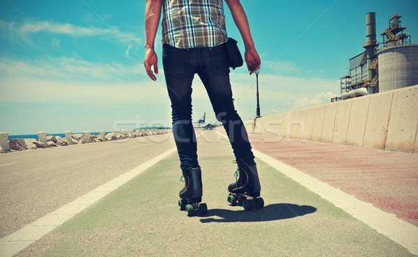 young man roller skating, with a cross-processed effect Stock photo © nito