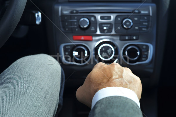 Jeune homme costume conduite voiture manuel [[stock_photo]] © nito