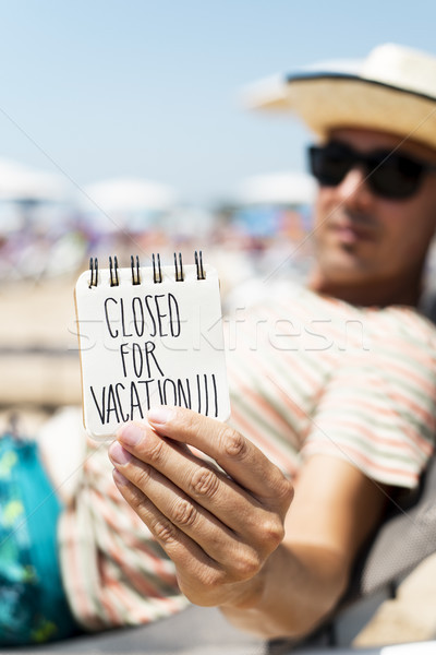 man with a note with the text closed for vacation
 Stock photo © nito