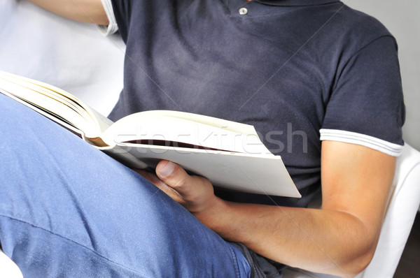 young man reading a book Stock photo © nito
