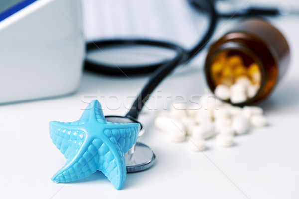 starfish and pills on the doctors desk Stock photo © nito