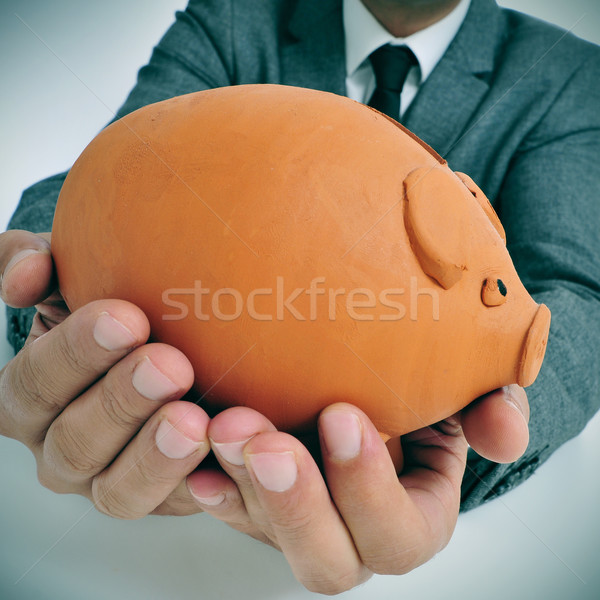 man in suit with a piggy bank Stock photo © nito
