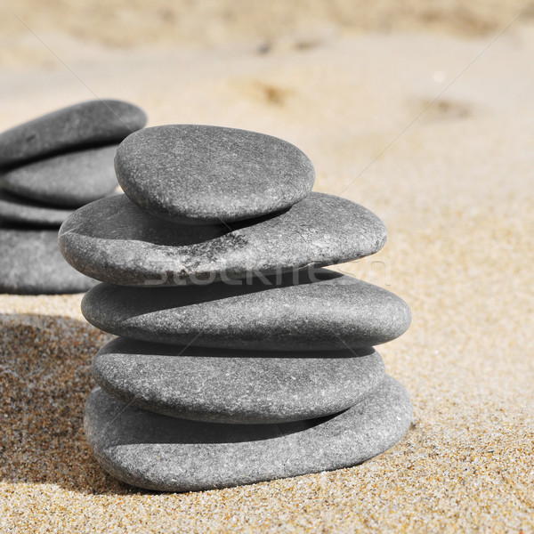 stacks of stones on the sand of a beach Stock photo © nito