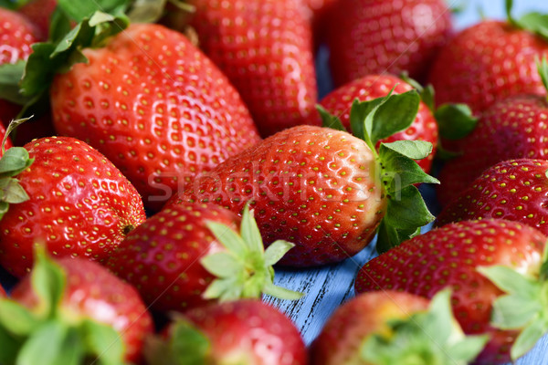 strawberries on a blue wooden surface Stock photo © nito