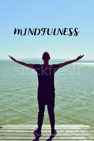 man saluting the new day and the text mindfulness Stock photo © nito