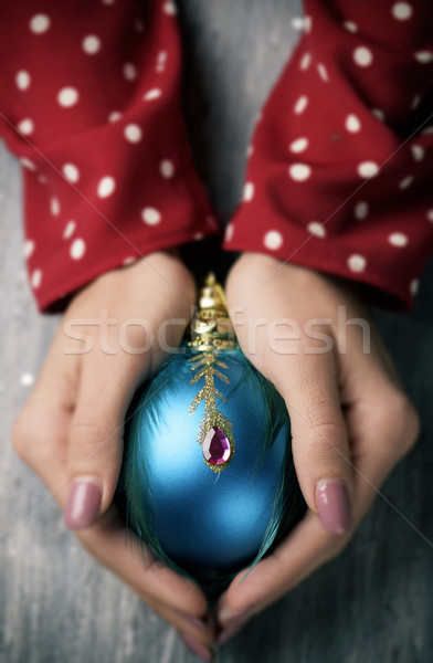 woman with an ornamented christmas ball Stock photo © nito