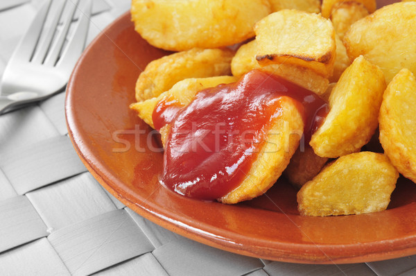 typical spanish patatas bravas, fried potatoes with a hot sauce Stock photo © nito