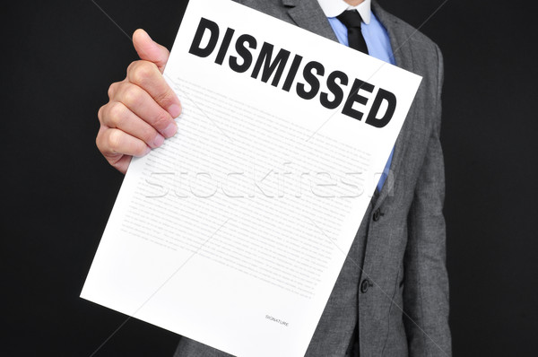 man in suit showing a document with the text dismissal Stock photo © nito