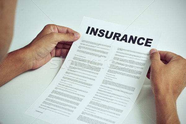 man reading the terms of an insurance Stock photo © nito