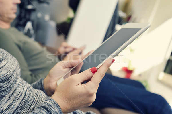 man and woman using electronic devices Stock photo © nito