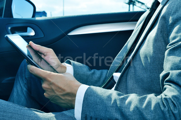 businessman using a tablet in a car Stock photo © nito
