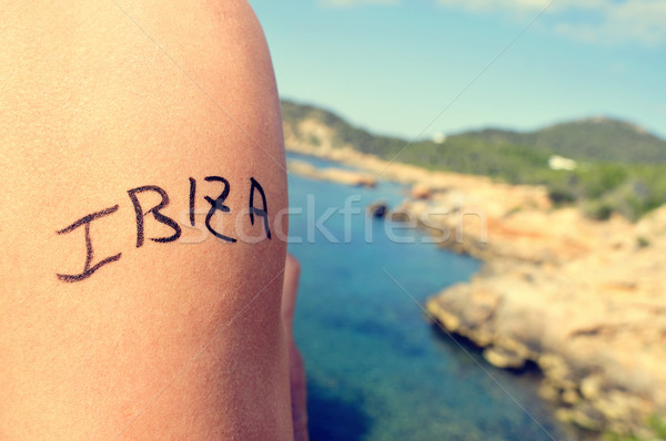 young man with the word Ibiza written in his arm Stock photo © nito