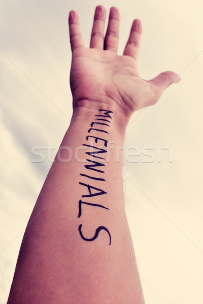 young man with the word millennials written in his arm, filtered Stock photo © nito