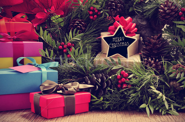 gifts, christmas wreath and text merry christmas in a star-shape Stock photo © nito