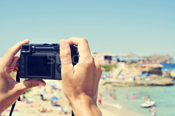 man taking a picture at Cala Conta beach in San Antonio, Ibiza I Stock photo © nito