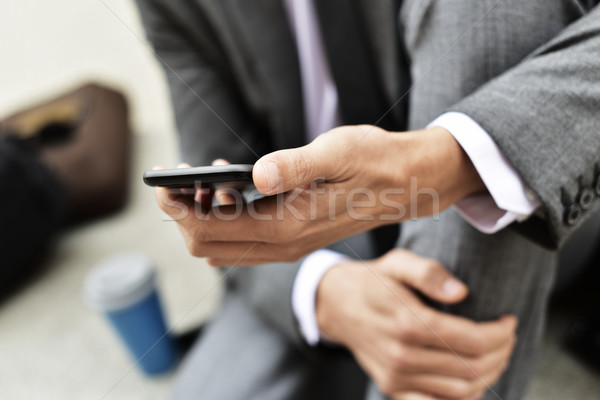 young businessman using a smartphone Stock photo © nito