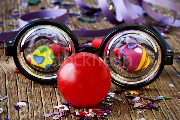 fake eyeglasses, red clown nose and confetti Stock photo © nito