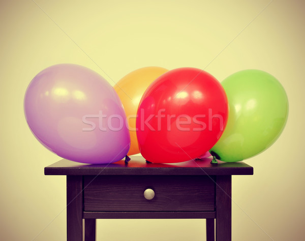 balloons of different colors on a table, with a retro effect Stock photo © nito