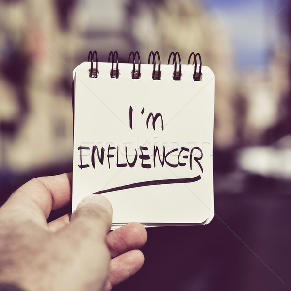 Stock photo: man and text I am influencer in a note
